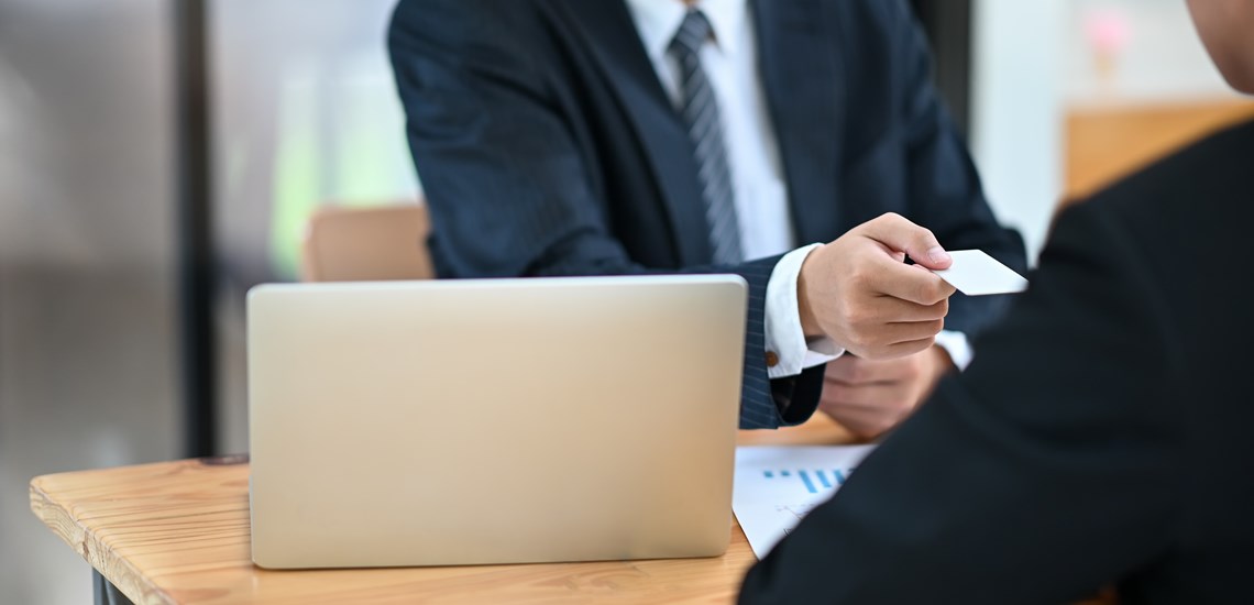 Mortgage adviser with client discussing remortgaging