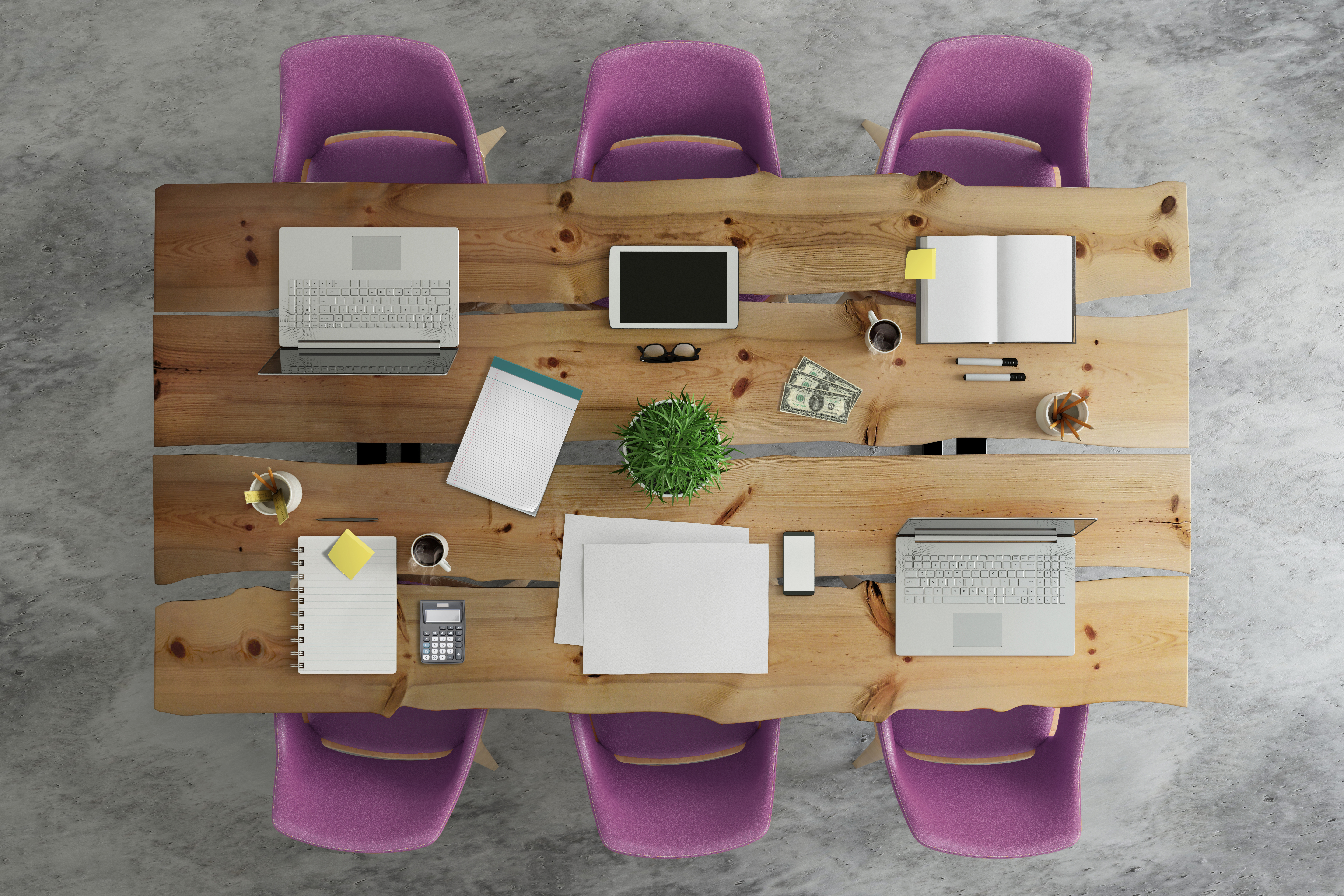 purple chairs around meeting table with notepads and coffee cup